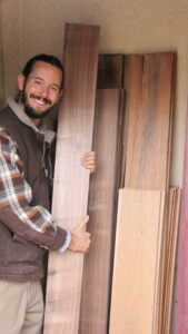 Grayson Henshaw holding precious wood for Native flutes.